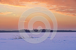 Fiery sunrise over lake Uvildy in winter, southern Ural, Chelyabinsk region