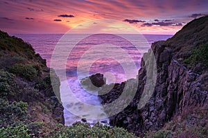 Fiery sunrise skies at Minamurra Headland South Coast Australia