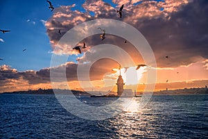 Fiery sunset over Bosphorus with famous Maiden`s Tower