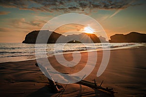 Fiery sunset over Elephant Rock Formation at Bandon Beach in Oregon.