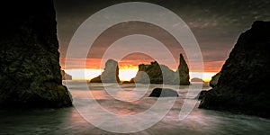 Fiery sunset over sea stacks in Bandon, Oregon, USA.