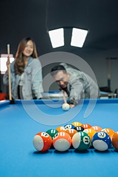 fifteen billiard balls aimed by the male billiard playerplayer