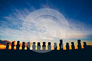 Fifteen standing moai on Ahu Tongariki against dramatic sunrise