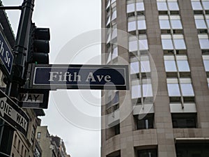 Fifth 5th Avenue street sign in New York City on a rainy and o