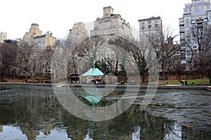 Fifth Avenue skyline, view from Central Park over Conservatory Water, New York, NY, USA