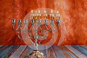 Fifth day Hanukkah candles are burning on light of the Jewish holiday