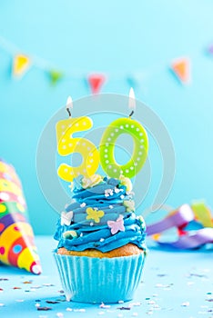 Fiftieth 50th birthday cupcake with candle. Card mockup.