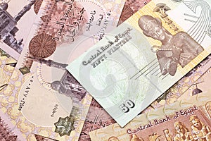 A fifty Egyptian piastres note with Egyptian one pound bank notes