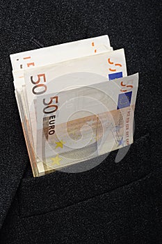 Fifty euros banknotes in pocket suit