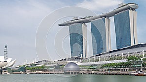 Fifty-five storeys high Marina Bay Sands Hotel dominates the skyline at Marina Bay in Singapore timelapse hyperlapse.