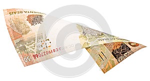 Fifty reais banknote falling on white background. Concept of light money, fortune, grand prize photo