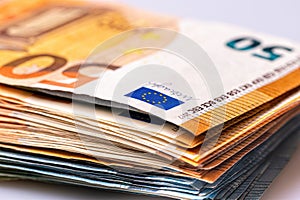 Fifty and twenty euro banknotes close-up. Cash background