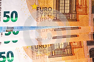 Fifty and twenty euro banknotes close-up. Cash background