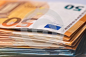 Fifty and twenty euro banknotes close-up. Cash background