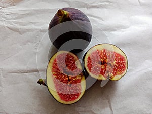 Fig.  Fig fruit on white paper.