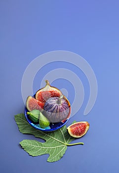 fig fruit and fig leaf in a plate