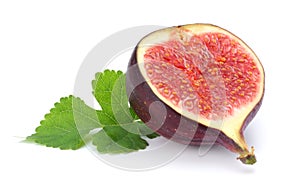 Fig fruit with green leaf isolated on white. Clipping Path