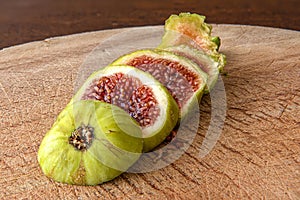 The fig fruit on wooden presentation