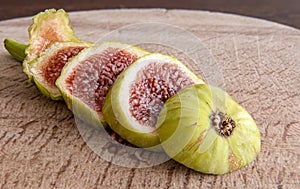 The fig fruit on wooden presentation
