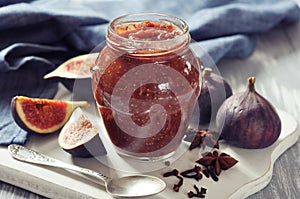 Fig jam in a glass jar photo