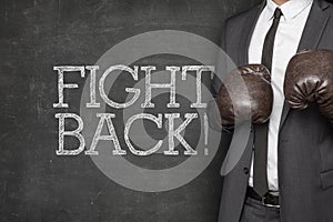 Fight back on blackboard with businessman