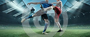 Cropped image of two soccer, football players in motion, action at stadium during football match. Concept of sport