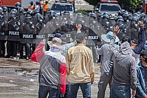 The fight between citizens and the police in the insurgency,uprising,People causing rioting against the government