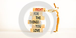 Fight for love symbol. Concept words Fight for the things you love on wooden blocks on a beautiful white table white background.