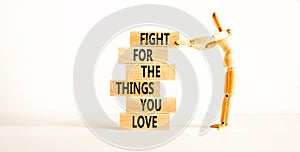 Fight for love symbol. Concept words Fight for the things you love on wooden blocks on a beautiful white table white background.