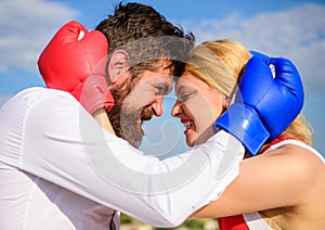 Fight for your happiness. Couple in love boxing gloves hug blue sky background. Man beard and girl cuddle happy after