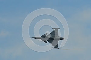 A fighter aircraft flying for display