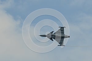 A fighter aircraft flying for display