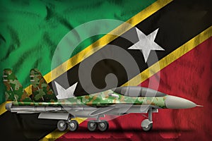 Fighter, interceptor with forest camouflage on the Saint Kitts and Nevis state flag background. 3d Illustration