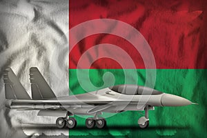 Fighter, interceptor on the Madagascar state flag background. 3d Illustration