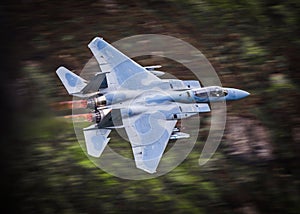 Fighter jet in full reheat afterburners photo