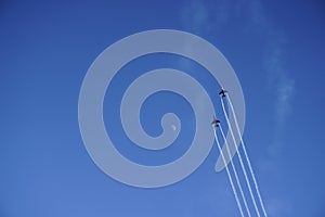 Fighter jets on blue sky with moon