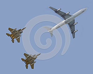 Fighter jets escorting passenger airplane