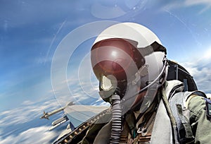 Fighter pilot cockpit view at sunrise