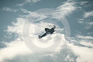 Fighter plane on cloudy sky