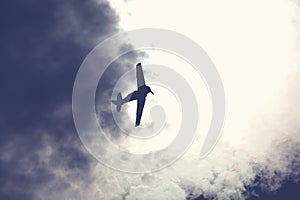 Fighter plane on cloudy sky