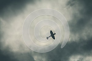 Fighter plane on cloudy sky