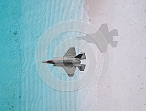 Fighter plane flies over a sea