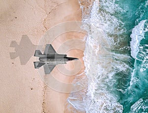 Fighter plane flies over a sea photo