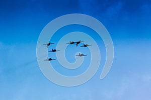 Fighter plane looping in turbo fly on the sky