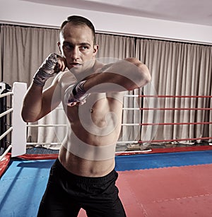 Fighter shadow boxing in the ring