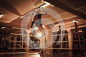 Fighter shadowboxing on training ring