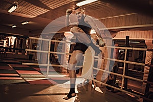 Fighter shadowboxing on training ring