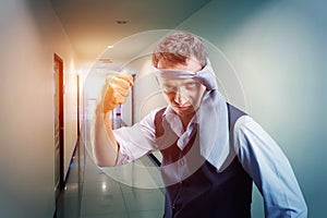 Fighting businessman with a tie on his head