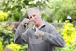 Fighting fit old man in garden