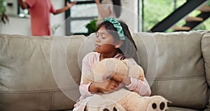 Fighting, parents and girl on a sofa with teddy bear for comfort from noise, shouting or toxic at home. Family, stress